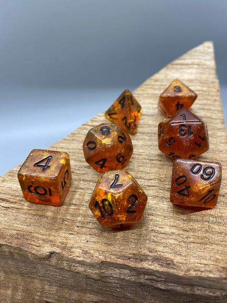 Orange Glitter with Black Numbers Polyhedral Resin Dice Set.   Complete set.