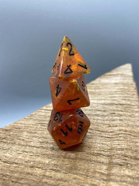 Orange Glitter with Black Numbers Polyhedral Resin Dice Set.   Complete set.